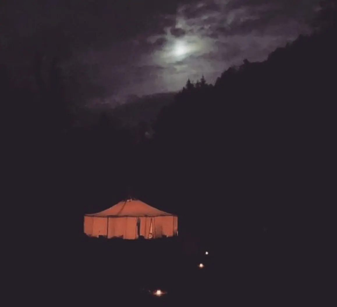 Yurt illuminated by fire